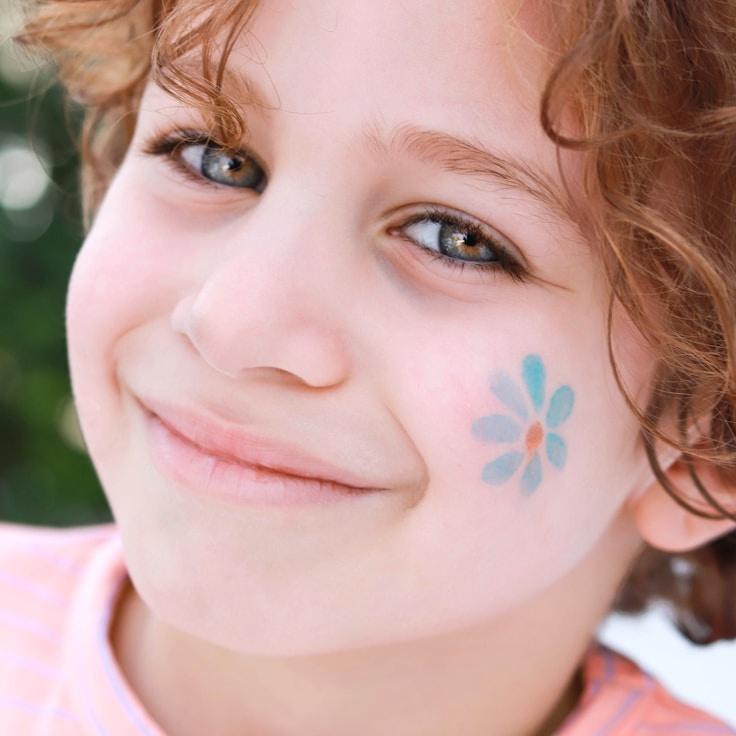 Alexia Rao, Lead Design Curator at MistHarborAutumn, reviewing corporate floral arrangements